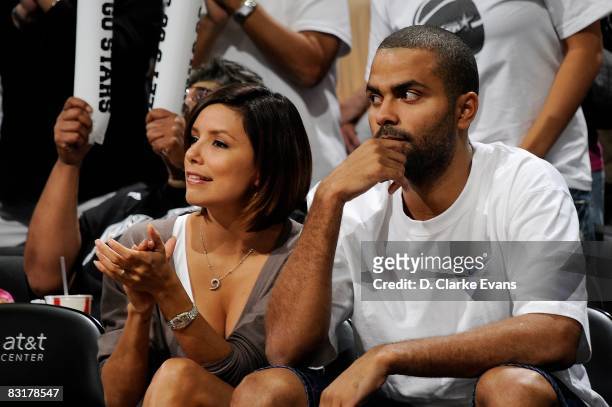 Tony Parker of the San Antonio Spurs and his wife Eva Longoria watch the game between the San Antonio Silver Stars and the Los Angeles Sparks in Game...