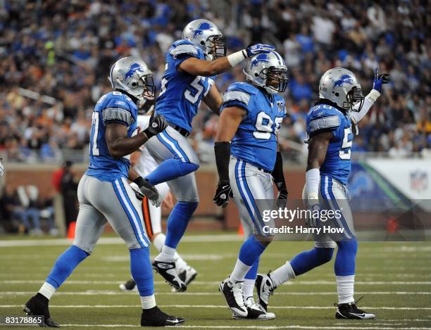 Leigh Bodden, Ryan Nece, Jared Devries, and Ernie Sims celebrate a defensive stand against the Chicago Bears during the first quarter at Ford Field...