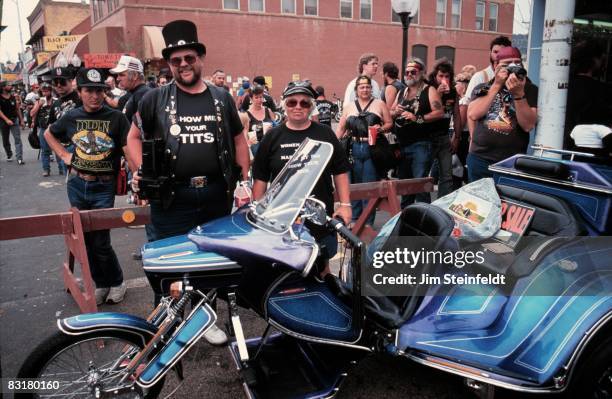 50th Anniversary of the World Famous Sturgis Motorcycle Rally. Man and Woman selling their three-wheeler in Sturgis, South Dakota on August 6, 1990.