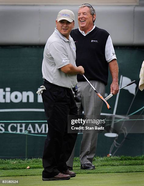Ramon Padilla, U.S. Army, left, and Fuzzy Zoeller, right, play the first green during the Pro-Am round for the Constellation Energy Senior Players...