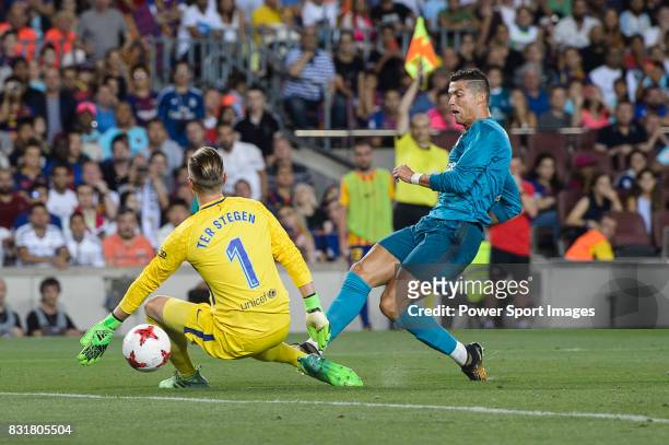 Cristiano Ronaldo of Real Madrid in action against Goalkeeper Marc-Andre Ter Stegen of FC Barcelona during the Supercopa de Espana Final 1st Leg...