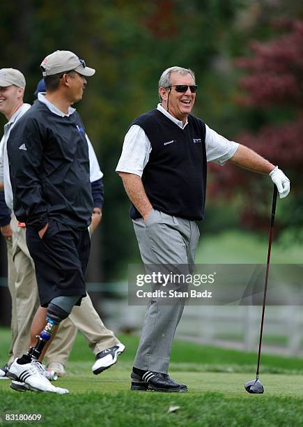 David Cook, U.S. Army, left, and playing partner Fuzzy Zoeller exchange a few laughs on the first tee during the Pro-Am round for the Constellation...