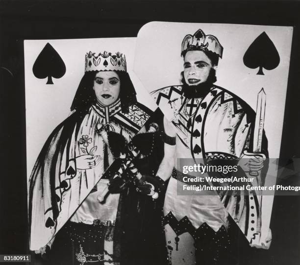 Royalty comes to the Artists Equity Association's Masquerade Ball as a man and woman dressed as the King and Queen of Spades display their sharp...