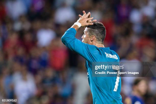 Cristiano Ronaldo of Real Madrid gestures after gets a red card during the Supercopa de Espana Final 1st Leg match between FC Barcelona and Real...