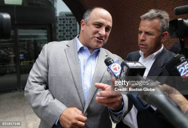 Defendant Robert Cafarelli talks with the media in front of the John Joseph Moakley Courthouse in Boston after being found not guilty of conspiracy...