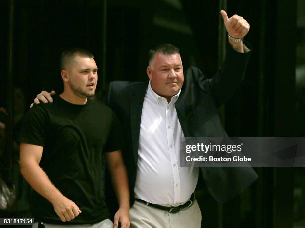 Defendant John Fidler, right, gestures as he leaves the John Joseph Moakley Courthouse in Boston after being found not guilty of conspiracy and...