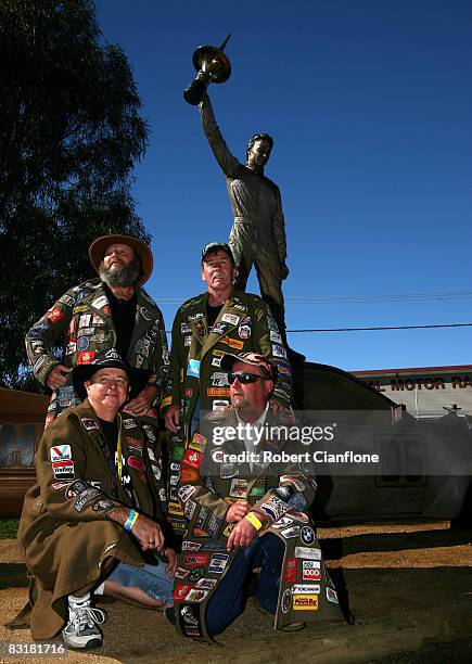 Peter Brock fans pose by the Peter Brock statue after its unveiling at the National Motor Racing Museum ahead of practice for the Bathurst 1000,...