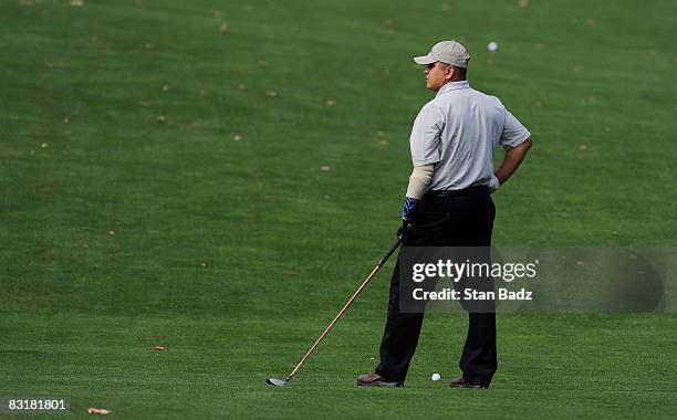 Ramon Padilla, U.S. Army, studies his second shot to the 17th green during the Pro-Am round for the Constellation Energy Senior Players Championship...