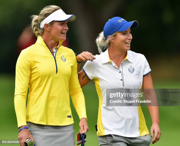 Suzann Pettersen and Melissa Reid of Team Europe share a joke during practice for The Solheim Cup at the Des Moines Country Club on August 15, 2017...