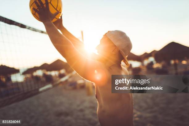 volleyball player in action - beachvolleyball stock pictures, royalty-free photos & images