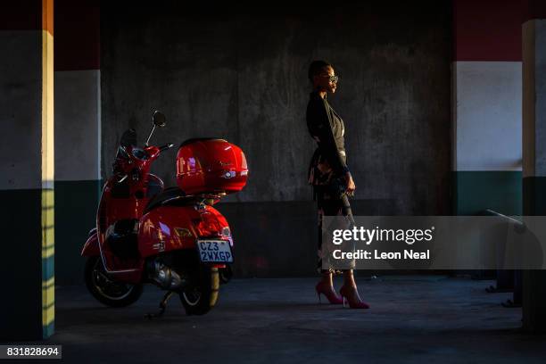 Television presenter Luthando Jhosha poses for photographs on the first day of South AFrica Fashion Week, on March 28, 2017 in Johannesburg, South...