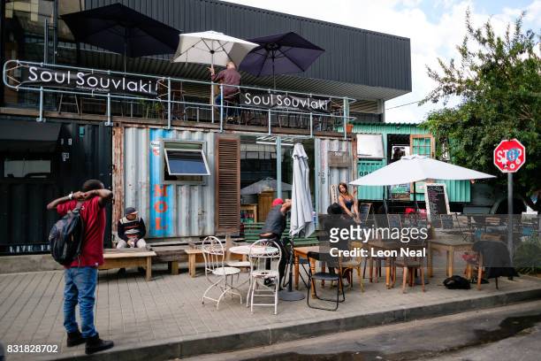 Photoshoot takes place outside a boutique coffee store on March 27, 2017 in the Maboneng district of Johannesburg, South Africa. Those born since the...
