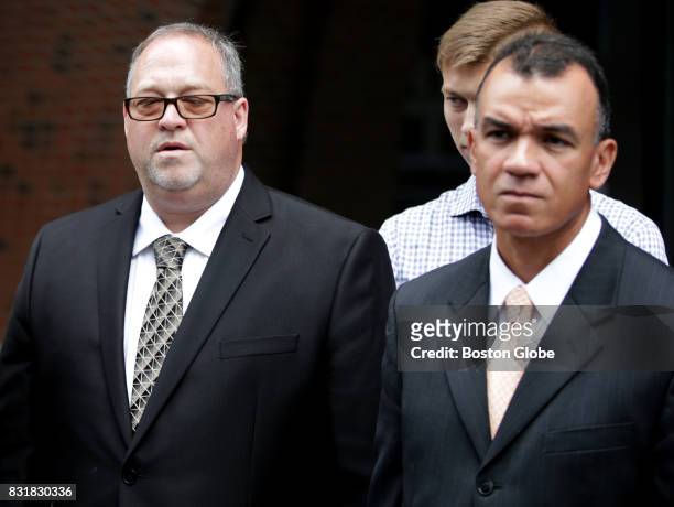 Defendant Daniel Redmond, left, leaves the John Joseph Moakley Courthouse after being found not guilty of conspiracy and attempted extortion on Aug....