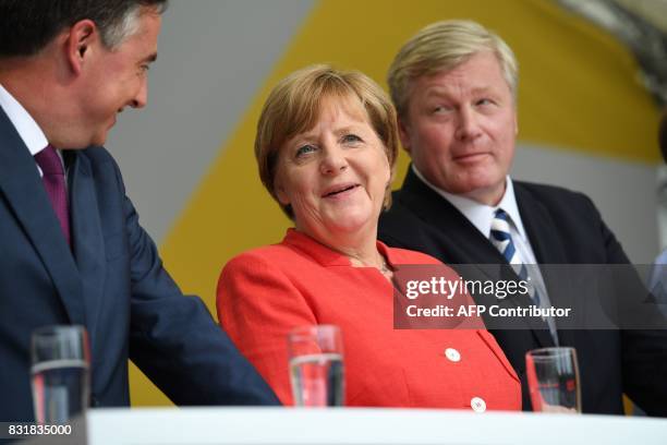 German Chancellor Angela Merkel chats with member of the European Parliament, David McAllister and Lower Saxony's CDU prime minister and candidate...