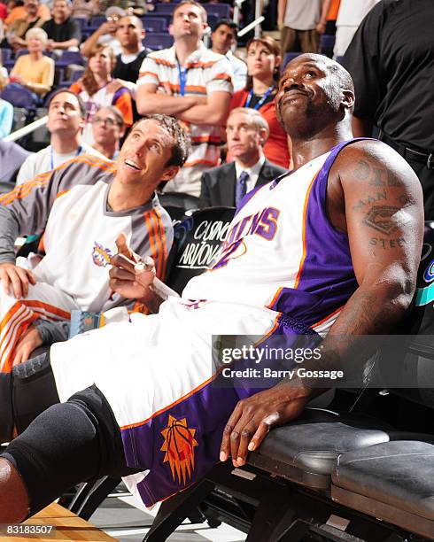 Steve Nash and Shaquille O'Neal of the Phoenix Suns watch the pregame festivities on the big screen as the Suns host the Atlanta Hawks in an NBA game...