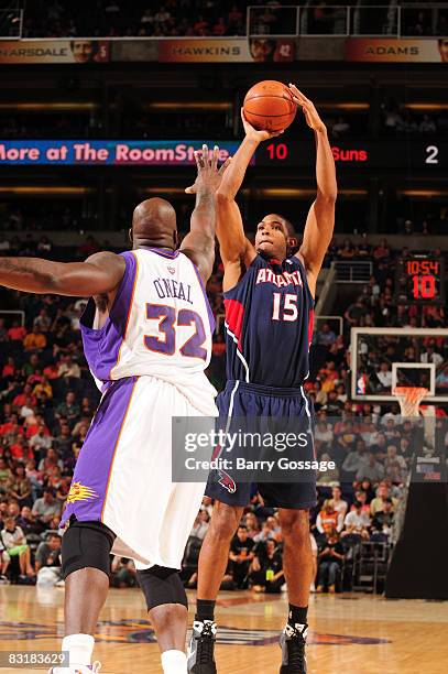 Al Horford of the Atlanta Hawks puts a shot up over Shaquille O'Neal of the Phoenix Suns in an NBA game played on October 8 at U.S. Airways Center in...