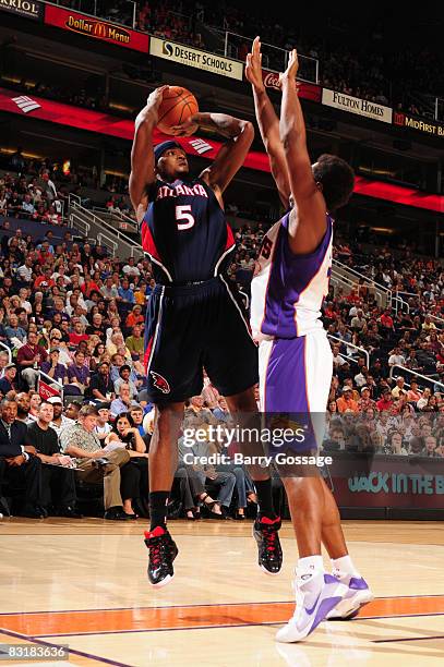 Josh Smith of the Atlanta Hawks puts a shot up over the block of Boris Diaw of the Phoenix Suns in an NBA game played on October 8 at U.S. Airways...