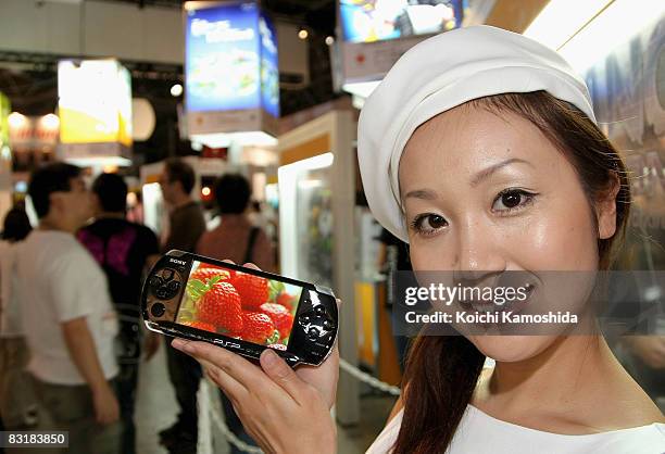 Model displays Sony Computer Entertainment's new PlayStation Portable during the Tokyo Game Show 2008 at Makuhari Messe on October 9, 2008 in Chiba,...