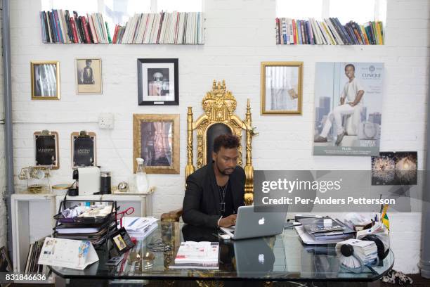 Celebrated South African fashion designer David Tlale works in his studio in Maboneng district on March 16, 2016 in downtown Johannesburg, South...