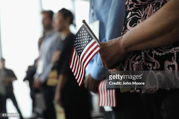 New Americans take part in a naturalization ceremony held in the observatory of the One World Trade Center on August 15, 2017 in New York City....
