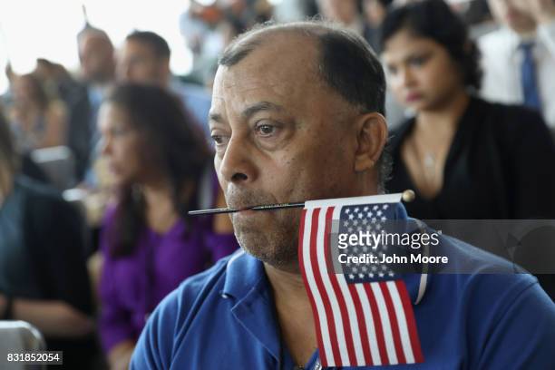 Family members watch as their loved ones take part in a naturalization ceremony held in the observatory of the One World Trade Center on August 15,...