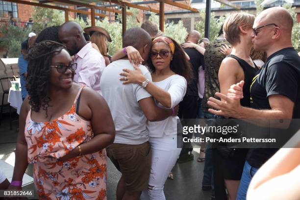 Visitors enjoy dancing salsa at the Sunday market on main in Maboneng district on March 20, 2016 in downtown Johannesburg, South Africa. A former...