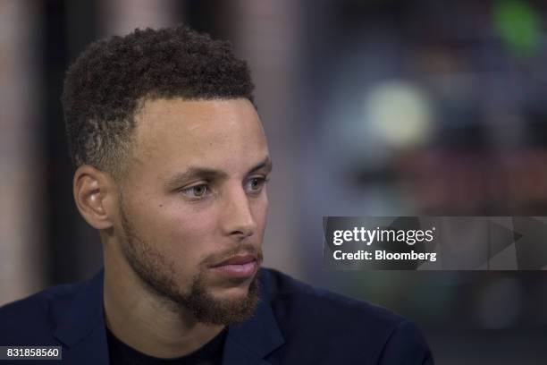 Stephen Curry, a professional basketball player with the National Basketball Association's Golden State Warriors, listens during a Bloomberg...