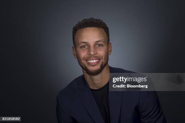 Stephen Curry, a professional basketball player with the National Basketball Association's Golden State Warriors, sits for a photograph following a...