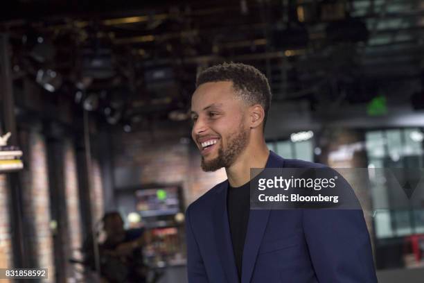 Stephen Curry, a professional basketball player with the National Basketball Association's Golden State Warriors, smiles following a Bloomberg...