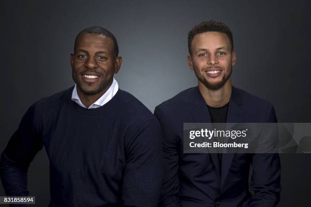 National Basketball Association's Golden State Warriors professional basketball players Andre Iguodala, left, and Stephen Curry sit for a photograph...
