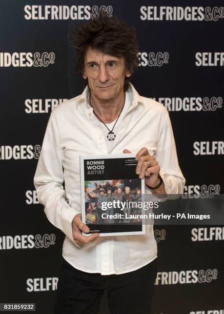 Ronnie Wood signs copies of his new book, Ronnie Wood: Artist at Selfridges in London.