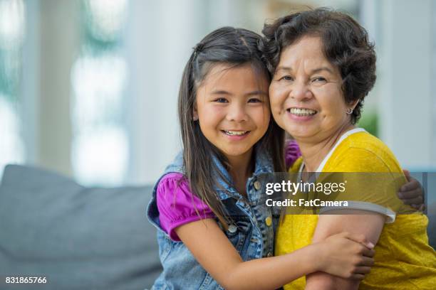 girl and grandmother - filipino family stock pictures, royalty-free photos & images