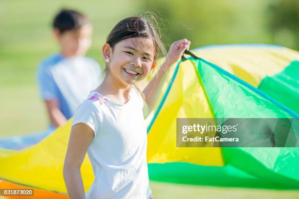 playing with parachute - farm bailout stock pictures, royalty-free photos & images