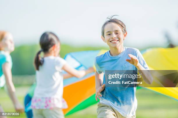 playing outside - farm bailout stock pictures, royalty-free photos & images