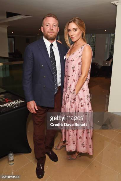 Guy Ritchie, winner of the Auteur Award, and wife Jacqui Ainsley attend the Raindance Film Festival anniversary drinks reception at The Mayfair Hotel...
