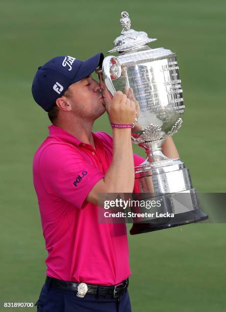 Justin Thomas of the United States poses with the Wanamaker Trophy after winning the 2017 PGA Championship during the final round at Quail Hollow...