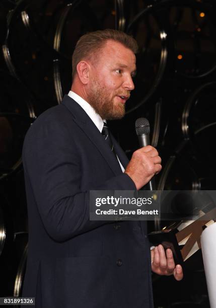 Guy Ritchie accepts the Auteur Award on stage at the Raindance Film Festival anniversary drinks reception at The Mayfair Hotel on August 15, 2017 in...