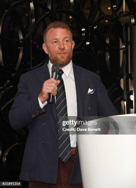 Guy Ritchie accepts the Auteur Award on stage at the Raindance Film Festival anniversary drinks reception at The Mayfair Hotel on August 15, 2017 in...