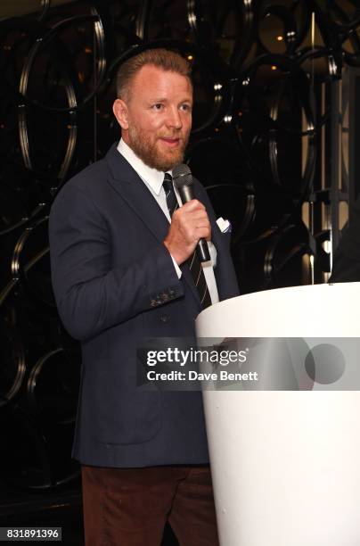 Guy Ritchie accepts the Auteur Award on stage at the Raindance Film Festival anniversary drinks reception at The Mayfair Hotel on August 15, 2017 in...