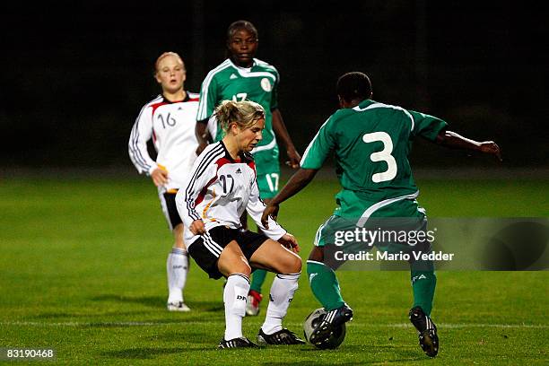 Svenja Huth of Germany and Doris Ewhubare of Nigeria fight for the ball during the U17 women international friendly match between Germany and Nigeria...