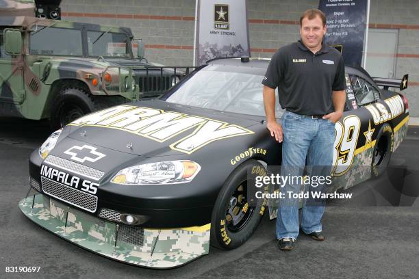 Ryan Newman, driver of the U.S. Army Chevrolet for the 2009 season, poses by the new car before practice for the NASCAR Sprint Cup Series Bank of...