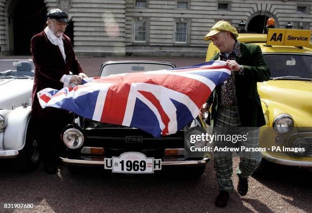 Roy Schubert and Andy Clapp both from Weston Super Mare drap a union Jack over their Triumph TR6, outside Buckingham Palace as the Duke of Gloucester...