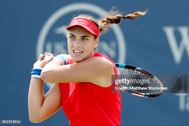 Ana Konjuh of Croatia returns a shot to Dominika Cibulkova of Slovakia during day 4 of the Western & Southern Open at the Lindner Family Tennis...