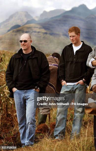 Prince Harry stands with Paddy Harveson the Prince of Wales Communications Secretary, stand in the Maluti Mountains in Lesotho Southern...