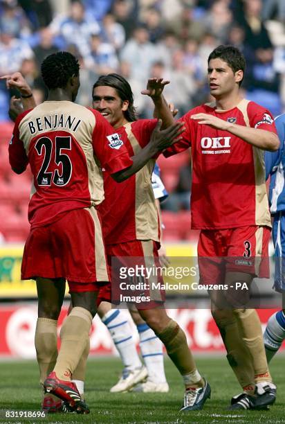 Portsmouth's Miguel Pedro Mendes and Dejan Stefanovic congratulate goal scorer Benjani Mwaruwari