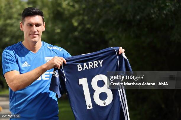 Gareth Barry signs for West Bromwich Albion on August 15, 2017 in West Bromwich, England.