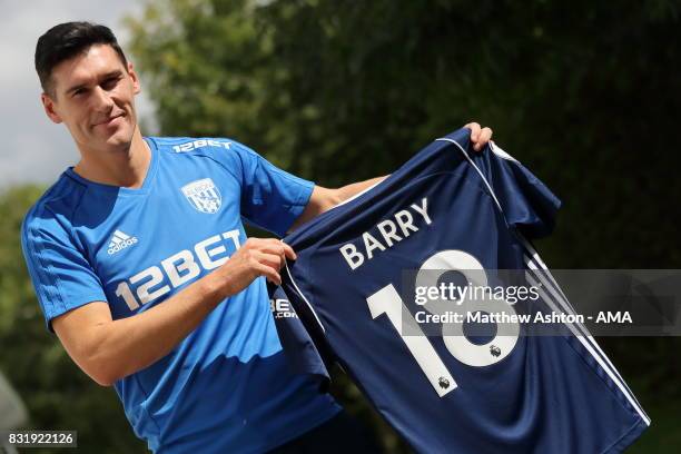 Gareth Barry signs for West Bromwich Albion on August 15, 2017 in West Bromwich, England.