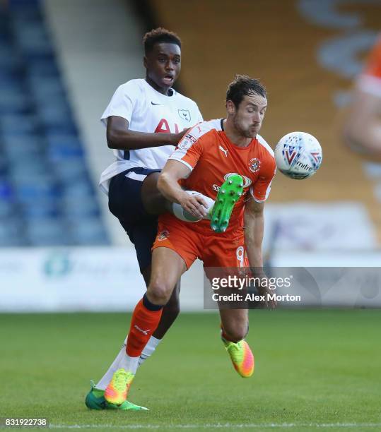 Jonathan Dinzeyi of Tottenham and Danny Hylton of Luton during the Checkatrade Trophy - Southern Section Group F match between Luton Town and...