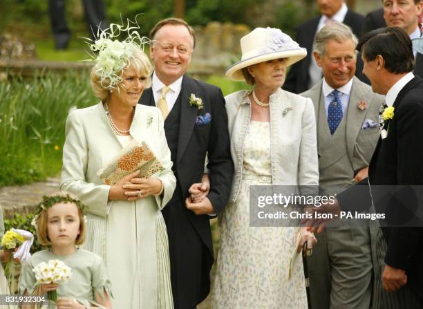 The Duchess of Cornwall leaves St Cyriac's Church in Lacock, Wiltshire, with her husband The Prince of Wales 2nd from , her former husband Andrew...