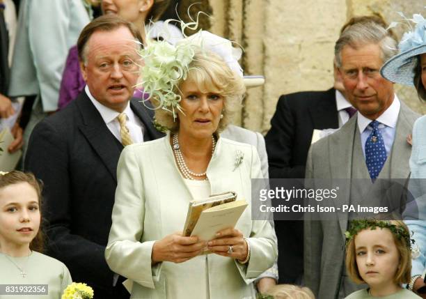 The Duchess of Cornwall leaves St Cyriac's Church in Lacock, Wiltshire, with her husband The Prince of Wales and her former husband Andrew Parker...